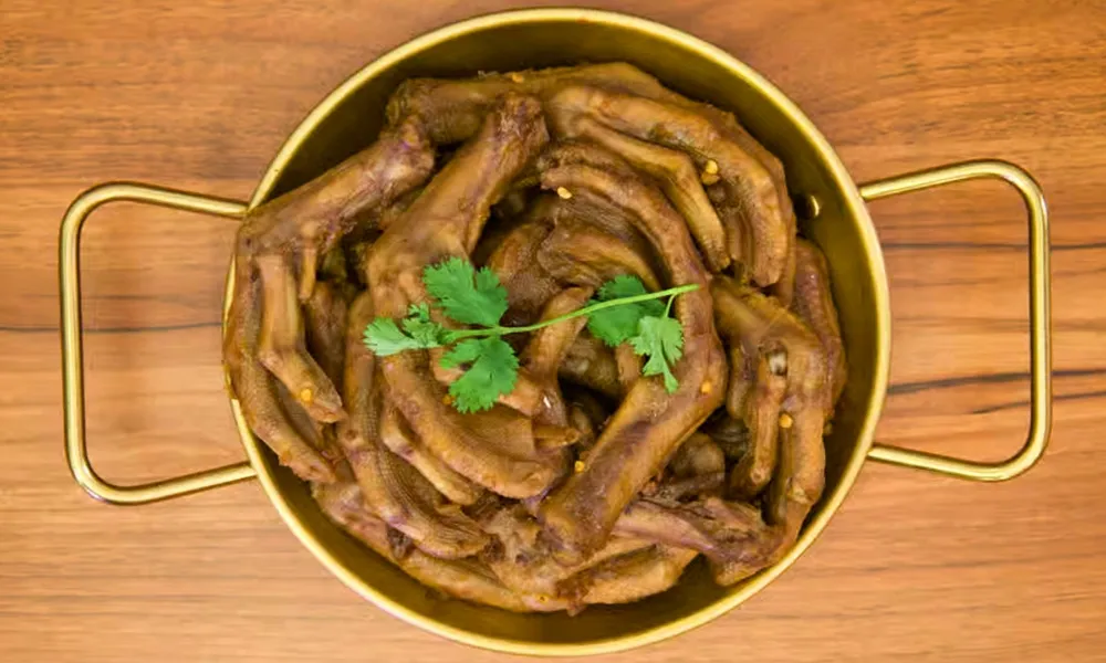 Braised savory duck paws garnished with cilantro at Top SF BBQ, a Barbecue Restaurant in San Francisco