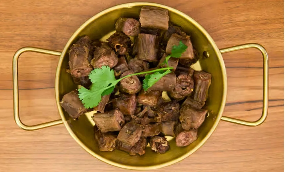 Braised spiced duck neck in golden pot at Top SF BBQ, a Barbecue Restaurant in San Francisco
