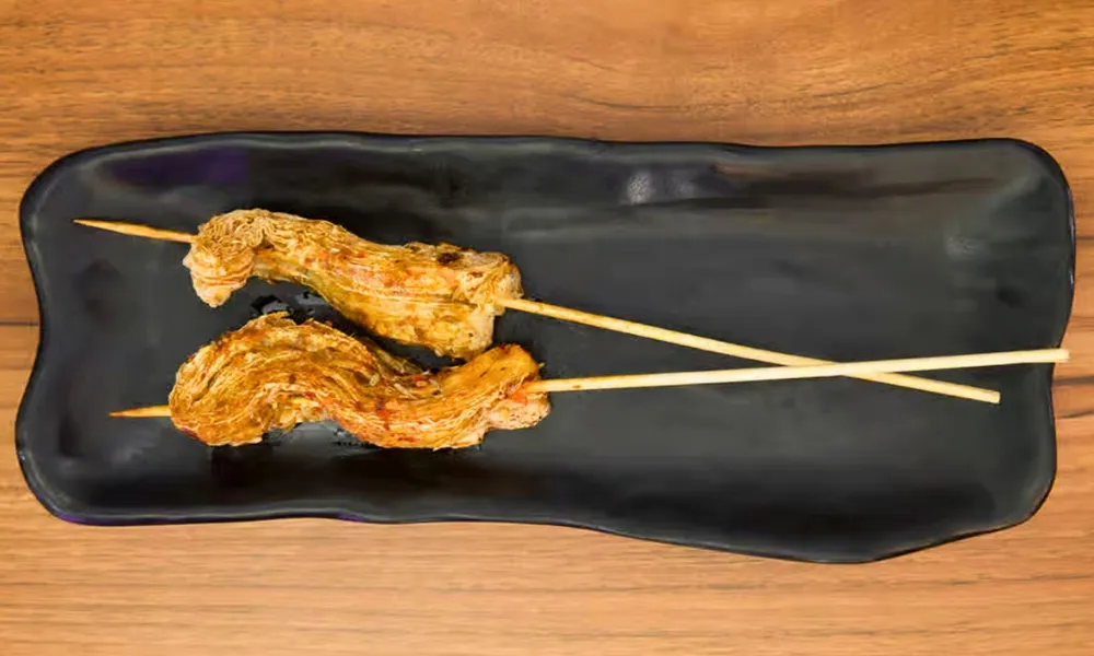 Grilled Grill Tofu Skin skewer with spices at Top SF BBQ, a Barbecue Restaurant in San Francisco