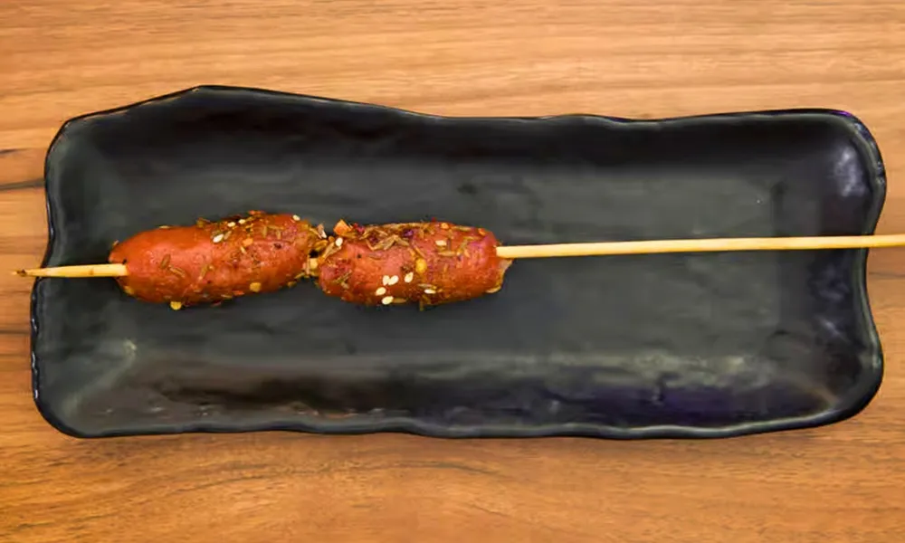 Seasoned grilled mini sausage skewer at Top SF BBQ, a Barbecue Restaurant in San Francisco