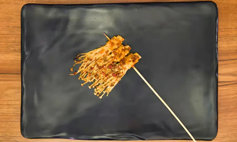 Spicy grilled enoki mushroom skewer at Top SF BBQ, a Barbecue Restaurant in San Francisco